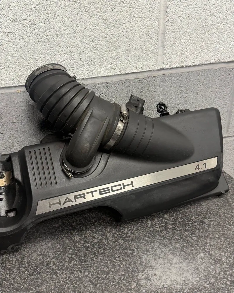 A Porsche airbox in the workshop with a Hartech 4.1 plaque fitted.