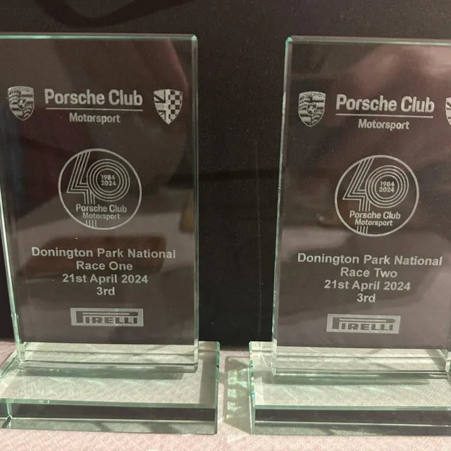 Two glass Porsche Club Motorsport trophies for third place at Donington Park, April 2024.