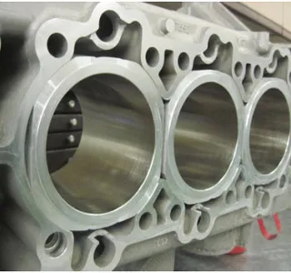 Six Hartech closed-deck Nikasil-plated alloy liners fitted into a machined crankcase, viewed from the deck.
